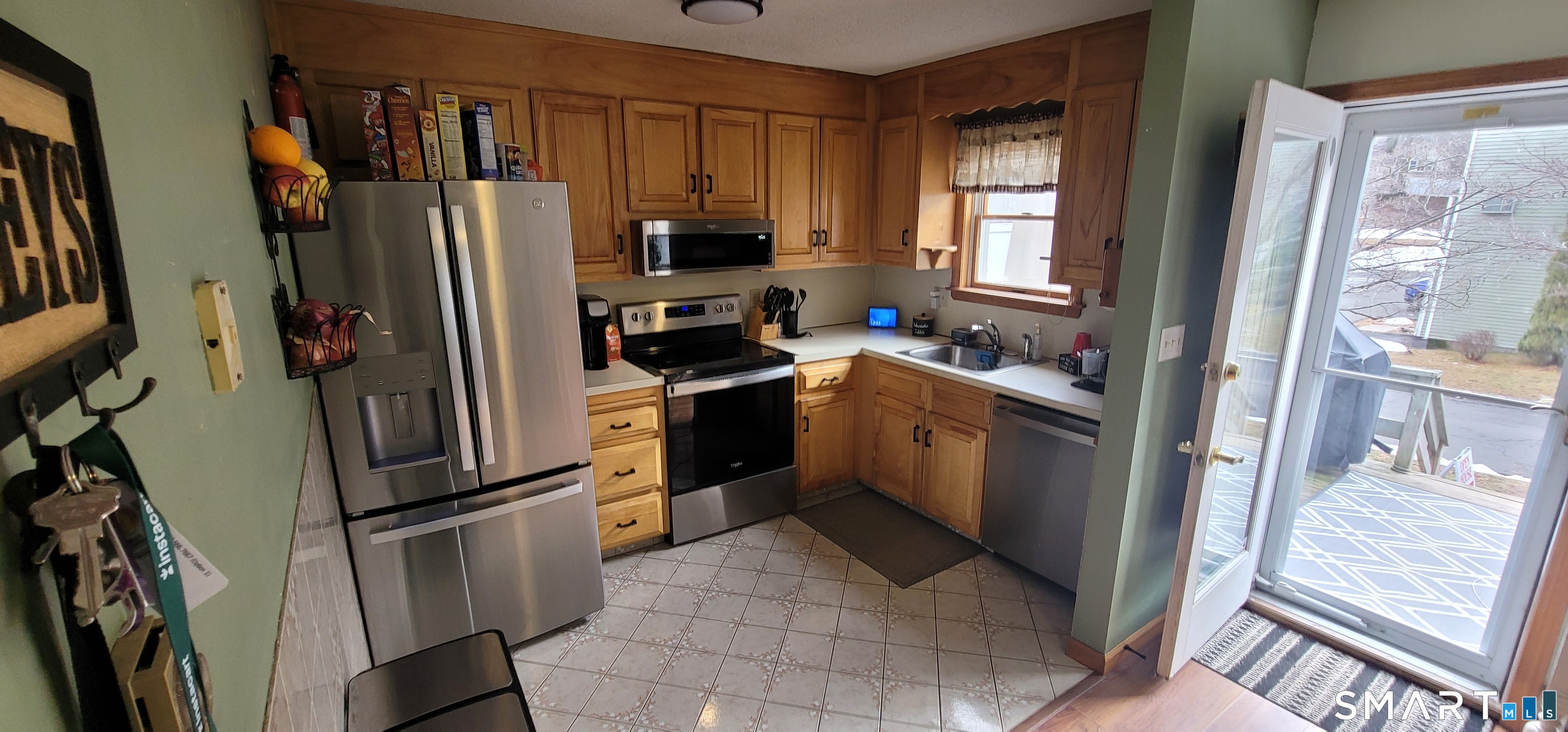 40 South Street, Unit 25 Bristol, CT 06010 - Photo 5 of 24 a kitchen with stainless steel appliances a refrigerator sink and microwave