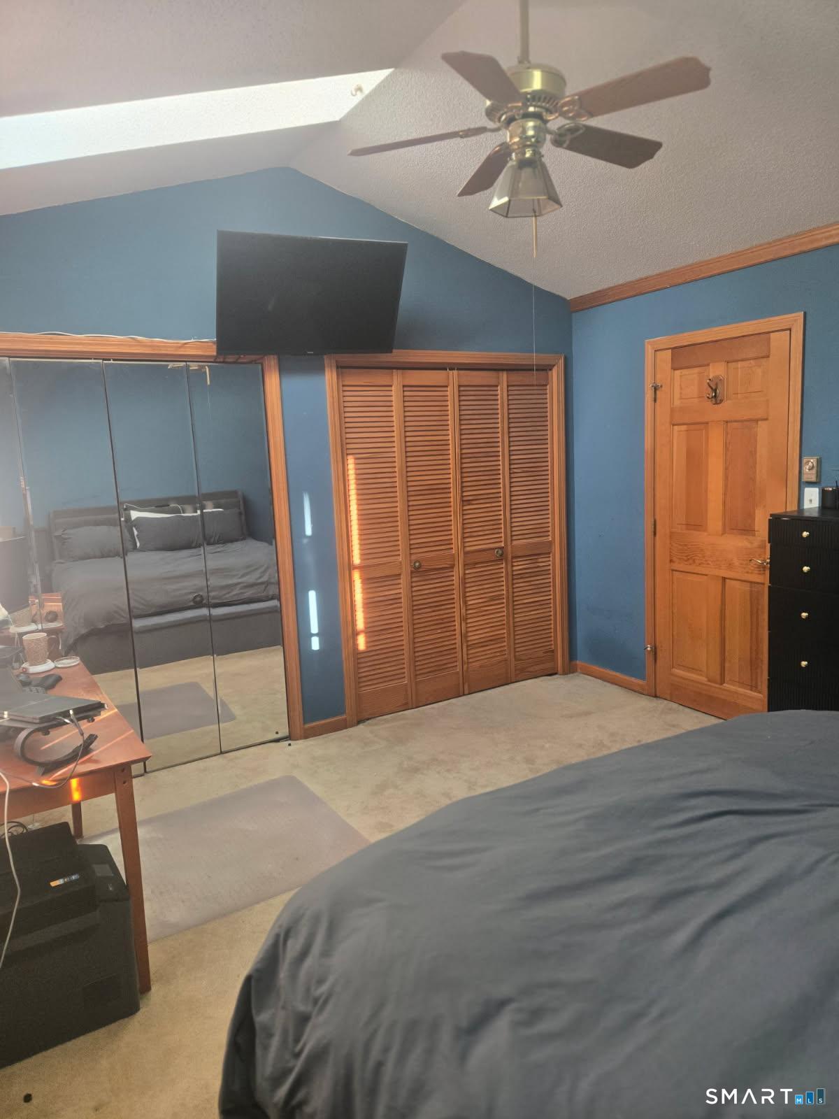 40 South Street, Unit 25 Bristol, CT 06010 - Photo 9 of 24 a bedroom with a bed and a ceiling fan