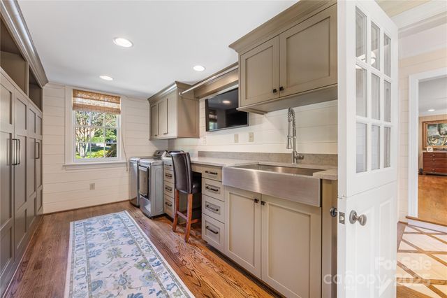 a kitchen with a stove a sink and a refrigerator