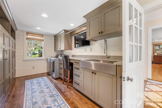 a kitchen with a stove a sink and a refrigerator