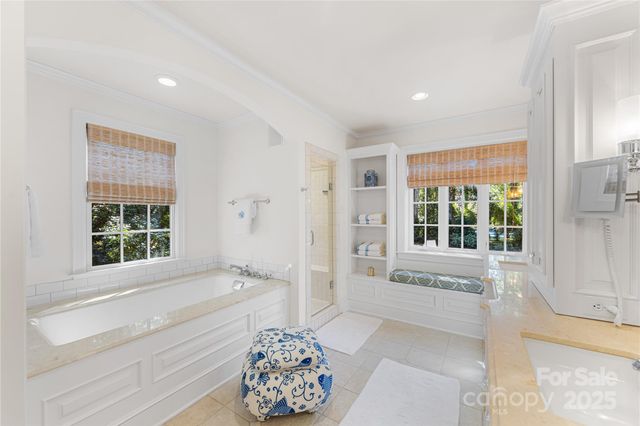 a spacious bathroom with sink and bathtub