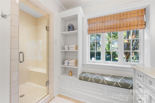a bathroom with a tub and shower