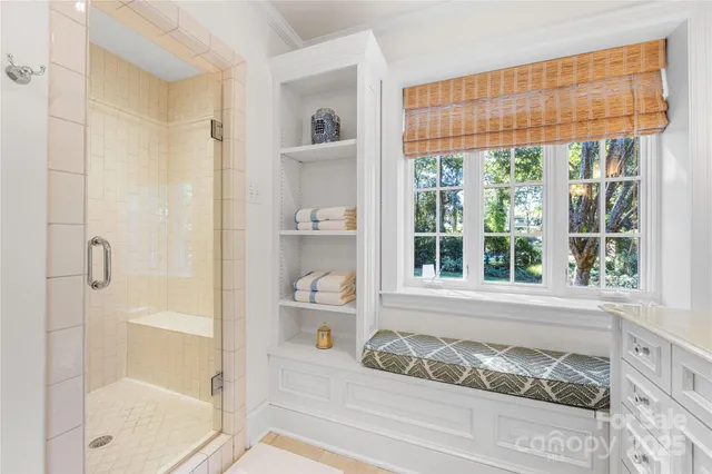 a bathroom with a tub and shower