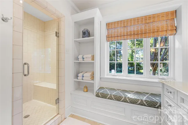 a bathroom with a tub and shower