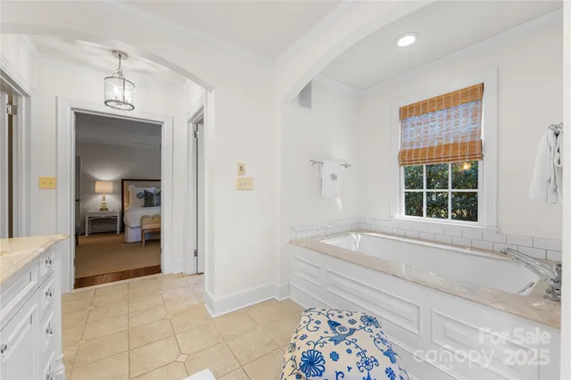 a spacious bathroom with a tub and a shower