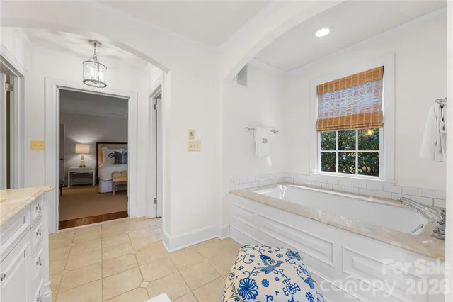 a spacious bathroom with a tub and a shower