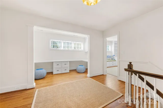 a bedroom with furniture and a window