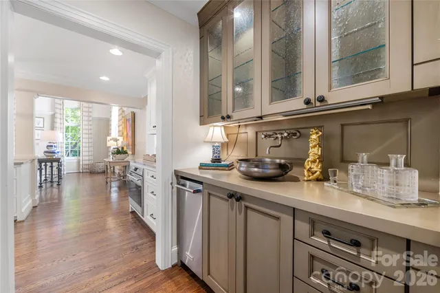 a kitchen with sink and cabinets