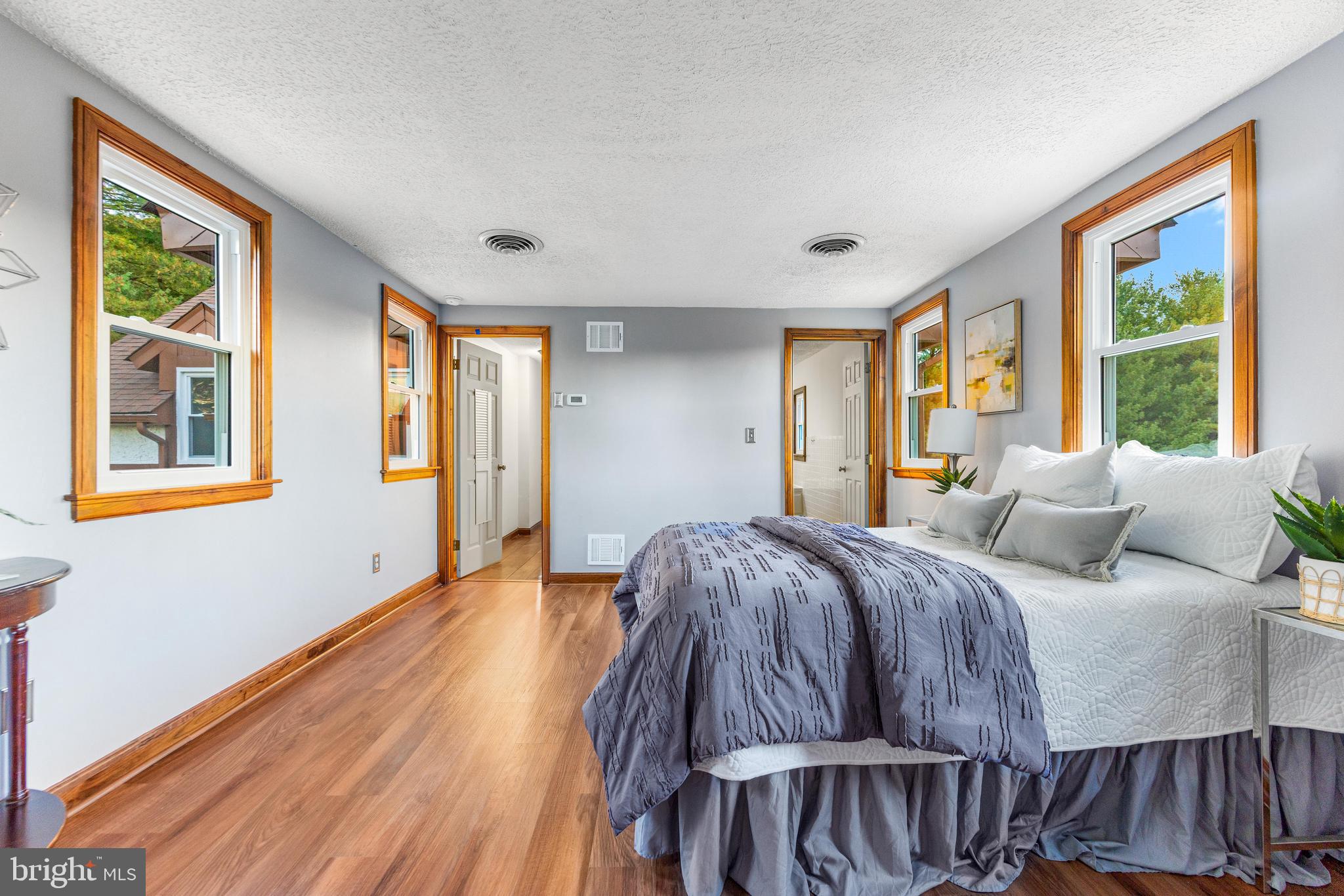 1763 Gablehammer Road Westminster, MD 21157 - Photo 19 of 51 a spacious bedroom with a bed and wooden floor