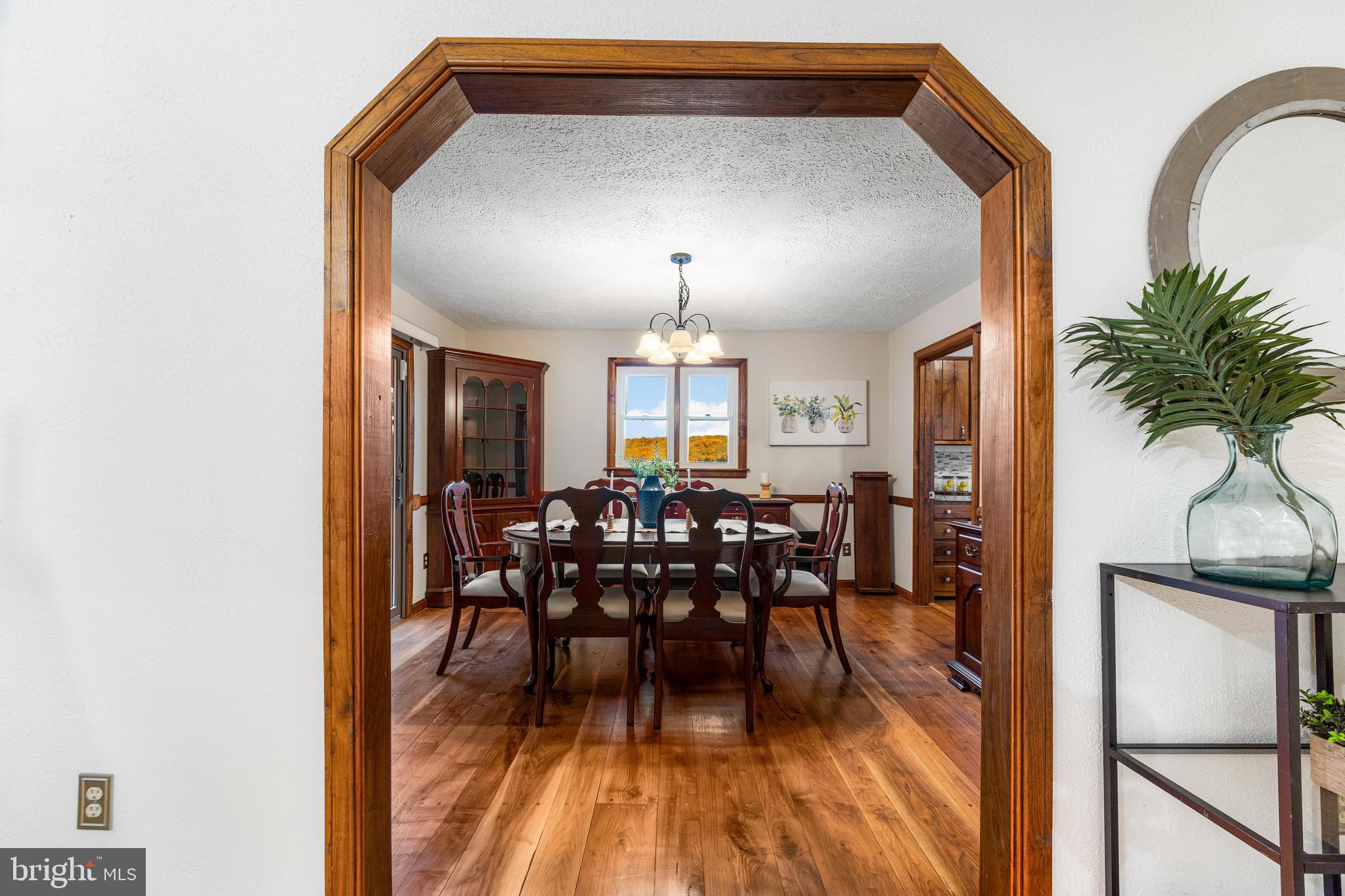 1763 Gablehammer Road Westminster, MD 21157 - Photo 8 of 51 a view of a dining room with furniture and wooden floor