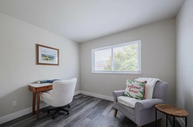 a workspace with furniture and a window