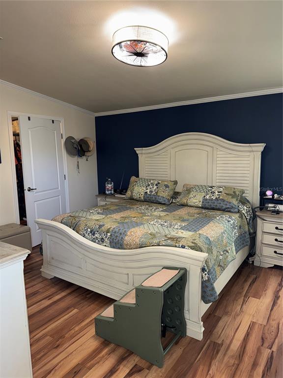 20732 South Grove Loop, Unit 630 Lutz, FL 33558 - Photo 11 of 28 a bedroom with a bed and a mirror
