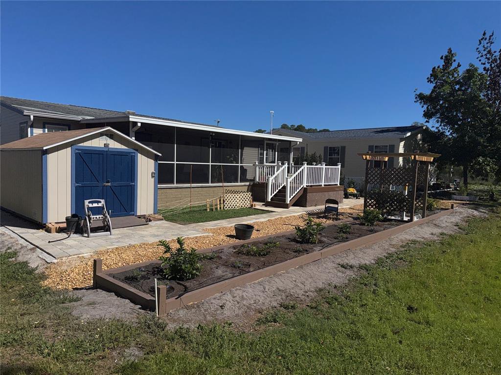 20732 South Grove Loop, Unit 630 Lutz, FL 33558 - Photo 2 of 28 a front view of a house with cars parked
