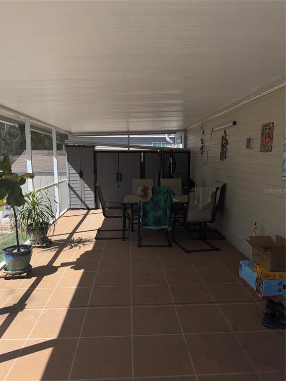 20732 South Grove Loop, Unit 630 Lutz, FL 33558 - Photo 22 of 28 a patio with table and chairs
