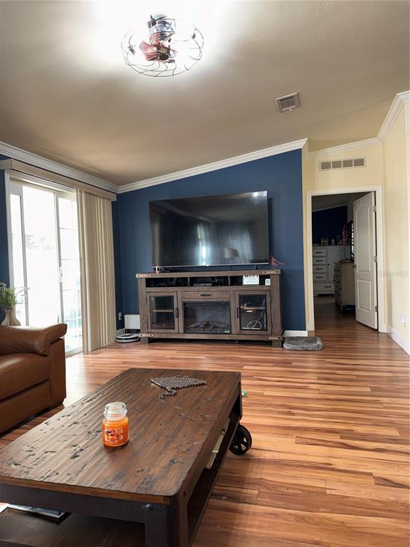 20732 South Grove Loop, Unit 630 Lutz, FL 33558 - Photo 6 of 28 a living room with furniture and a flat screen tv