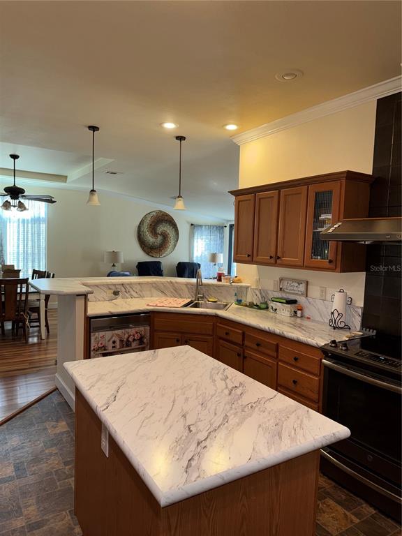 20732 South Grove Loop, Unit 630 Lutz, FL 33558 - Photo 8 of 28 a kitchen with a sink a stove and chairs