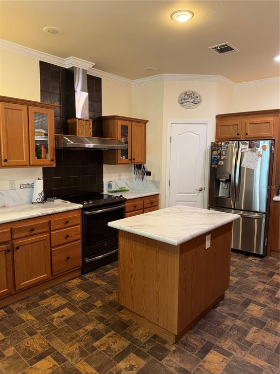 20732 South Grove Loop, Unit 630 Lutz, FL 33558 - Photo 9 of 28 a kitchen with stainless steel appliances granite countertop a stove and a refrigerator