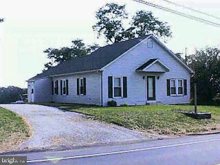 901 Delta Road Red Lion, PA 17356 - Photo 1 of 1 a front view of a house with a yard and garage