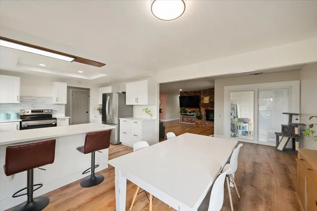 a view of a kitchen with dining table and chairs