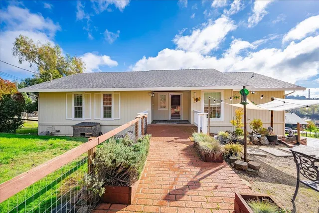 a front view of a house with garden