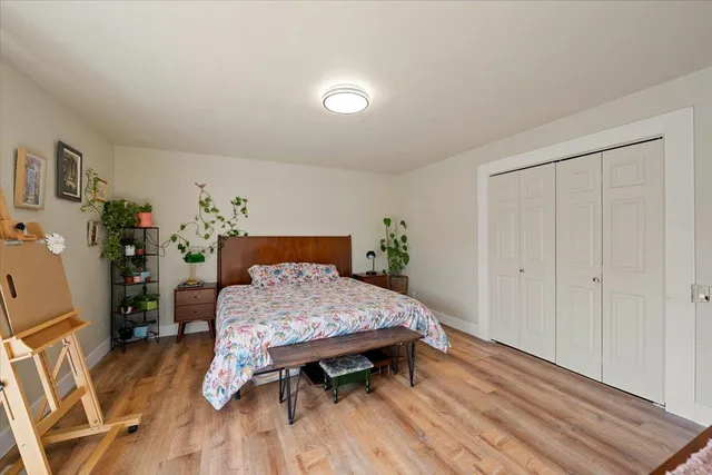 a bed room with a bed and a table