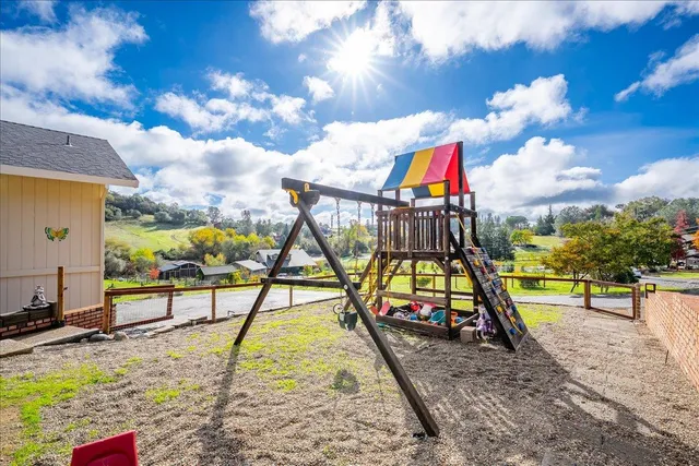 a view of swimming pool with sitting area