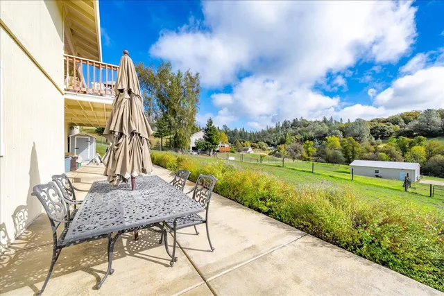a view of an chairs and tables in the patio