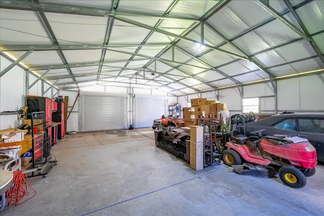 a view of parking garage with cars and other