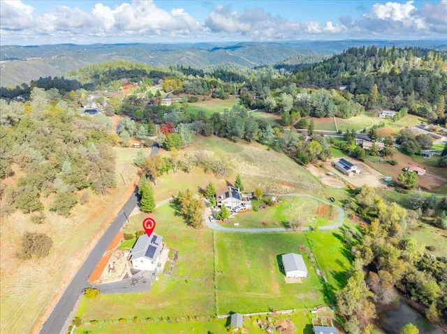 a view of swimming pool with a yard and seating area