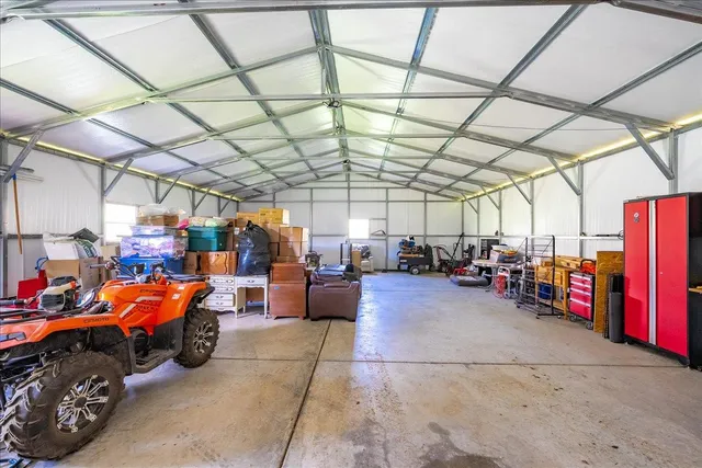 a view of parking garage with cars