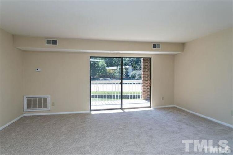 1022 Sandlin Place, Unit A Raleigh, NC 27606 - Photo 16 of 20 a view of an empty room with a window