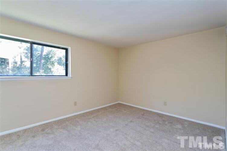 1022 Sandlin Place, Unit A Raleigh, NC 27606 - Photo 18 of 20 an empty room with windows