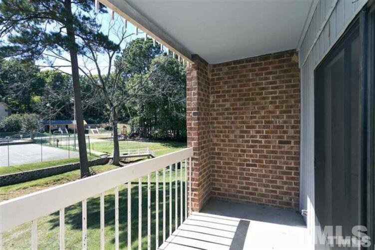 1022 Sandlin Place, Unit A Raleigh, NC 27606 - Photo 19 of 20 a view of a balcony with yard