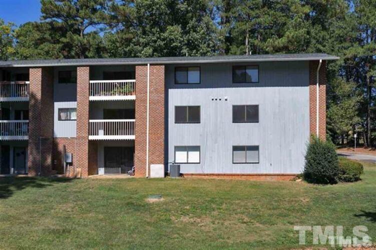 1022 Sandlin Place, Unit A Raleigh, NC 27606 - Photo 20 of 20 a front view of a house with garden