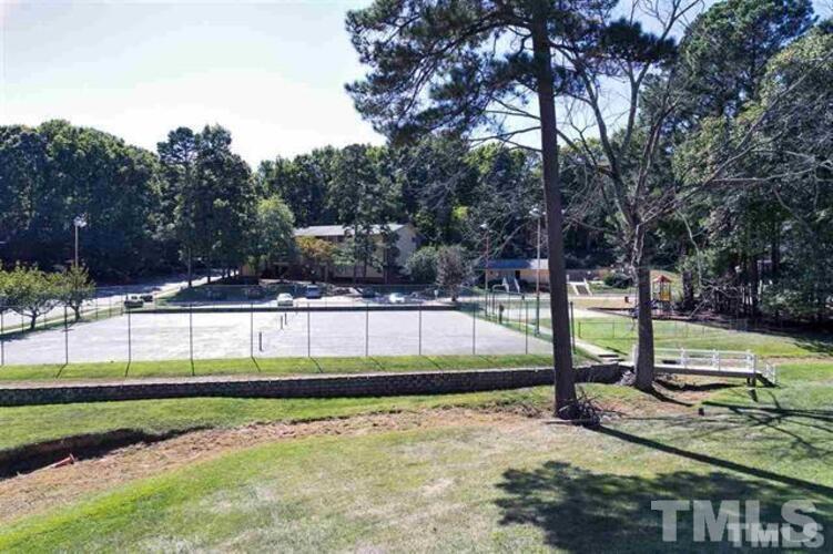 1022 Sandlin Place, Unit A Raleigh, NC 27606 - Photo 3 of 20 a view of a park with large trees