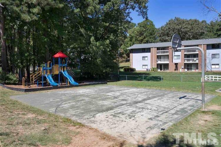 1022 Sandlin Place, Unit A Raleigh, NC 27606 - Photo 4 of 20 a view of a house with a yard and tree s