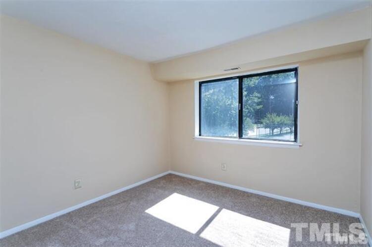 1022 Sandlin Place, Unit A Raleigh, NC 27606 - Photo 7 of 20 an empty room with a window