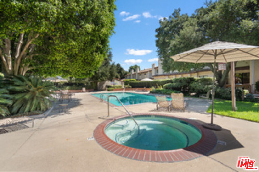 1114 Las Riendas Way Pasadena, CA 91107 - Photo 18 of 20 wooden view of a swimming pool with a patio