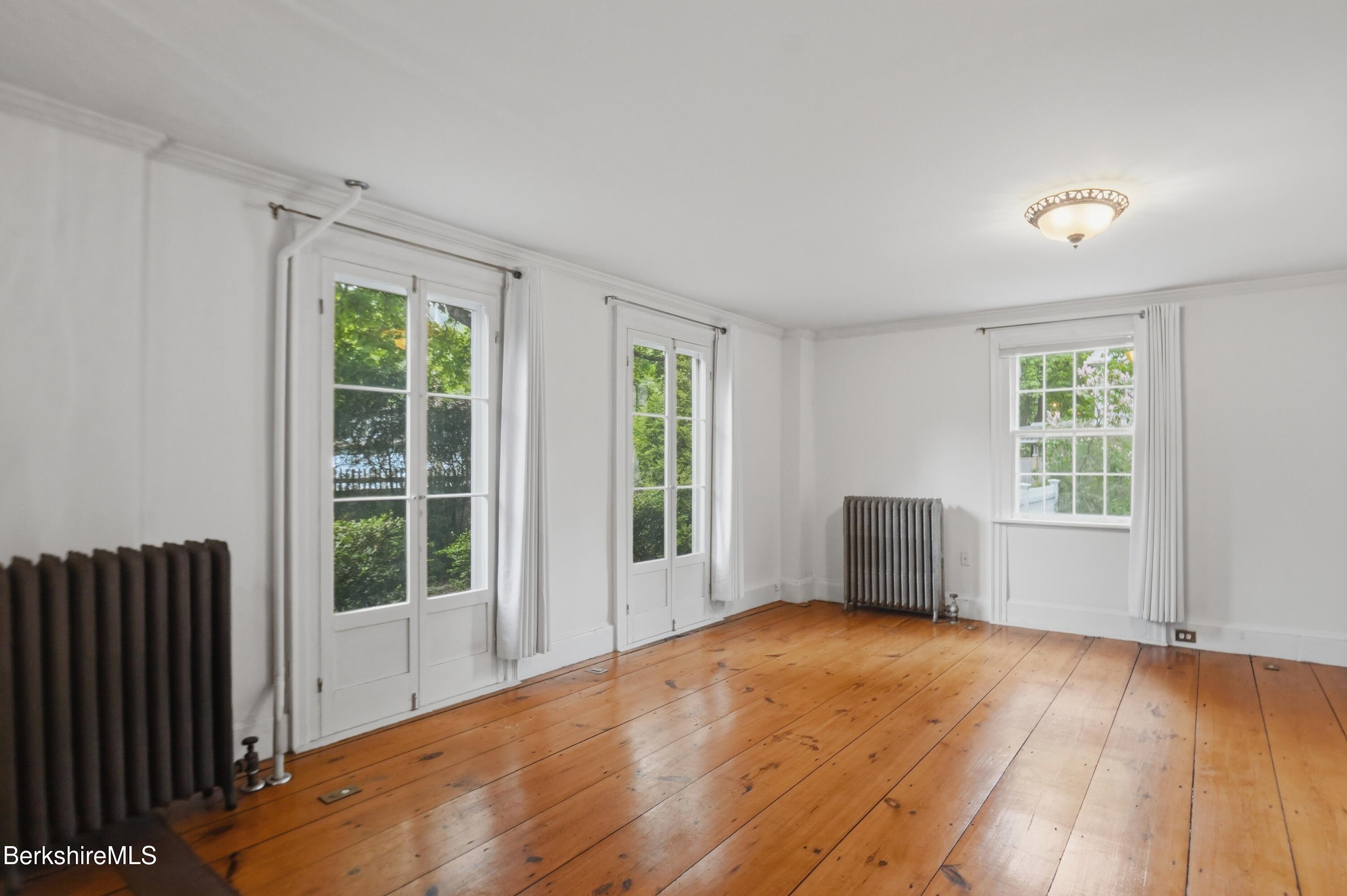 4 Stockbridge Road West Stockbridge, MA 01266 - Photo 17 of 94 an empty room with wooden floor and windows