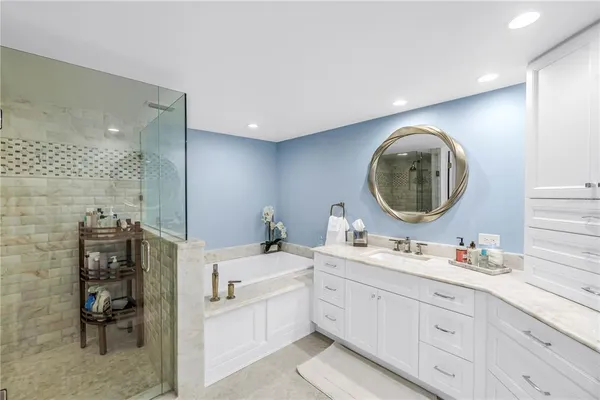 a bathroom with a shower and a sink
