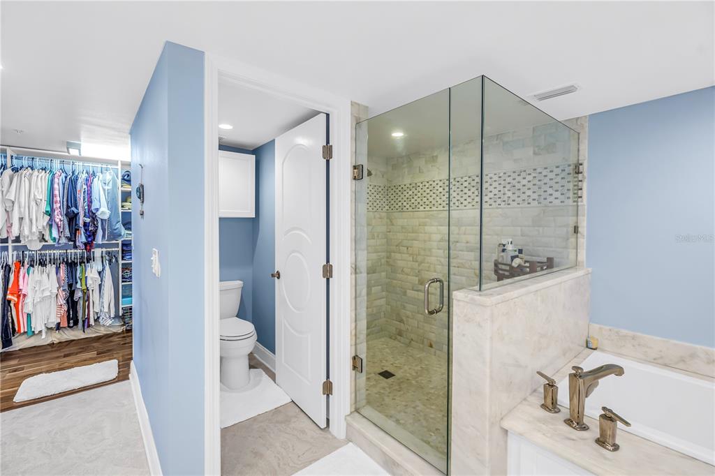 6650 Sunset Way, Unit 207 St. Pete Beach, FL 33706 - Photo 31 of 57 a bathroom with a shower and a sink