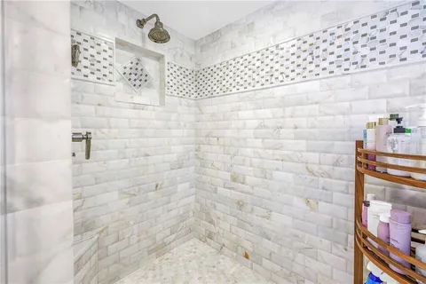 a view of a pathway with a wrought fence