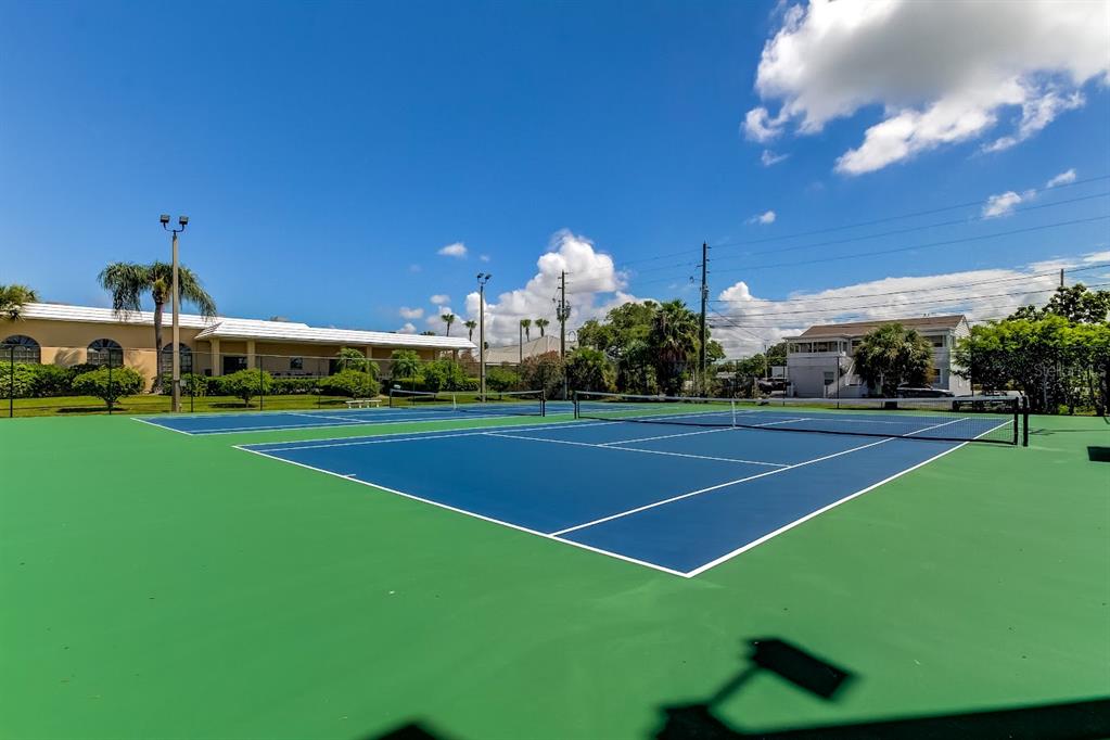6650 Sunset Way, Unit 207 St. Pete Beach, FL 33706 - Photo 46 of 57 a view of a tennis court