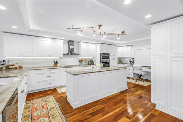 a view of a kitchen counter space and a sink