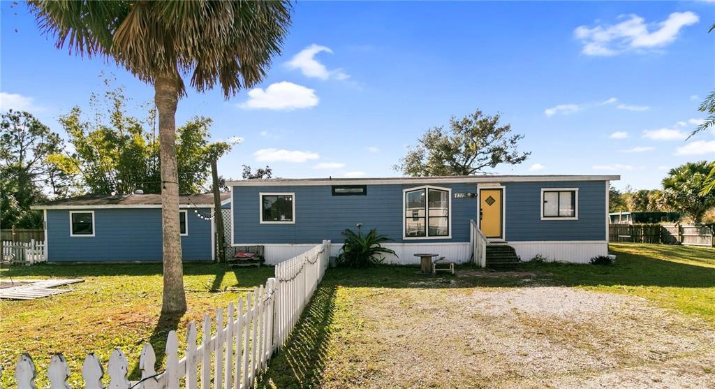 18312 16th Avenue Orlando, FL 32833 - Photo 1 of 26 a front view of a house with garden