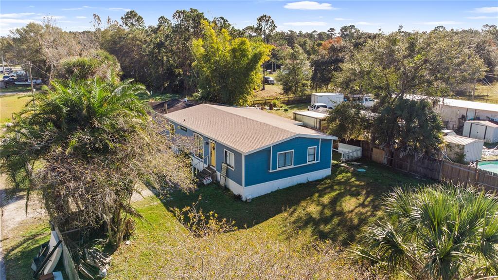 18312 16th Avenue Orlando, FL 32833 - Photo 18 of 26 a view of a house with a yard and mountain