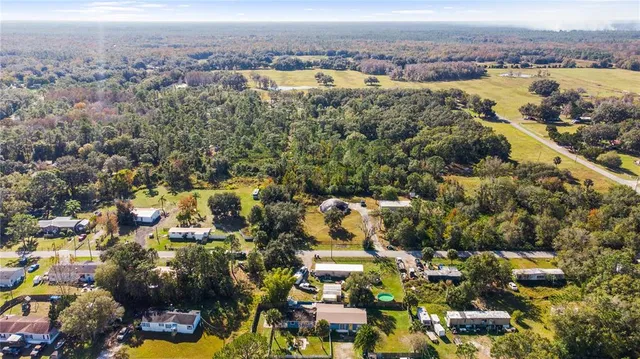 an aerial view of residential building with outdoor space and lake view