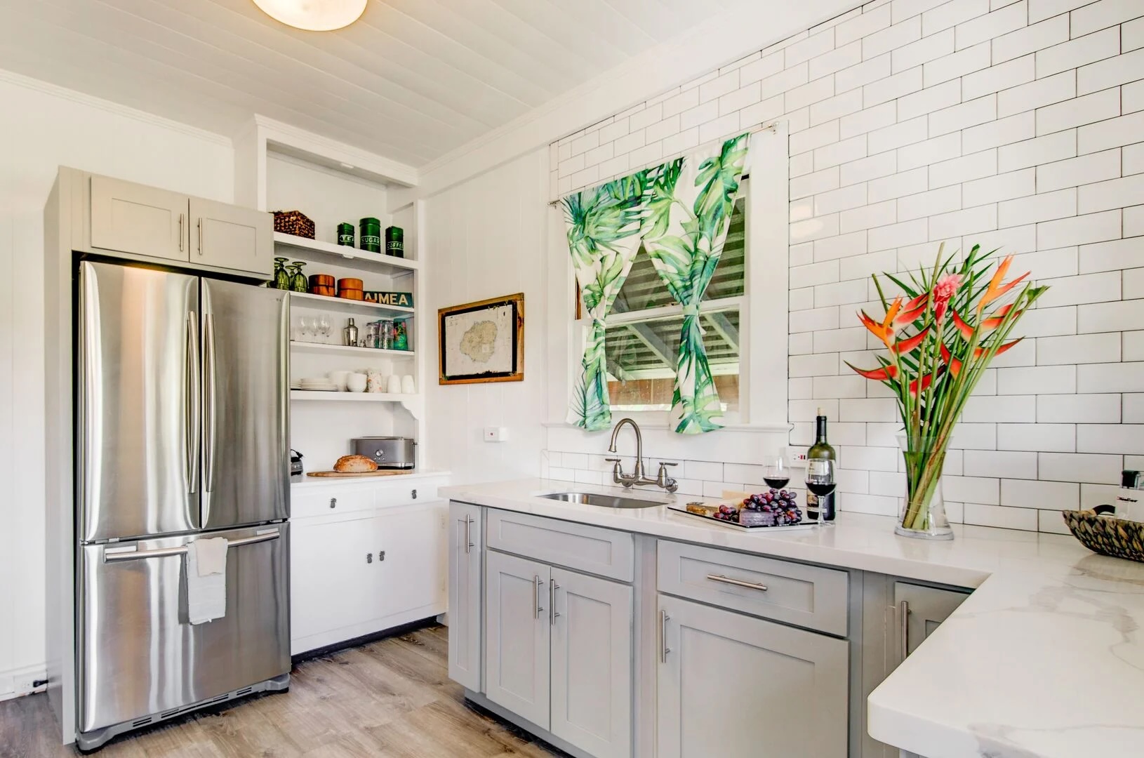 4462 Halepule Road Waimea, HI 96796 - Photo 1 of 11 a kitchen with stainless steel appliances a sink a refrigerator and a window