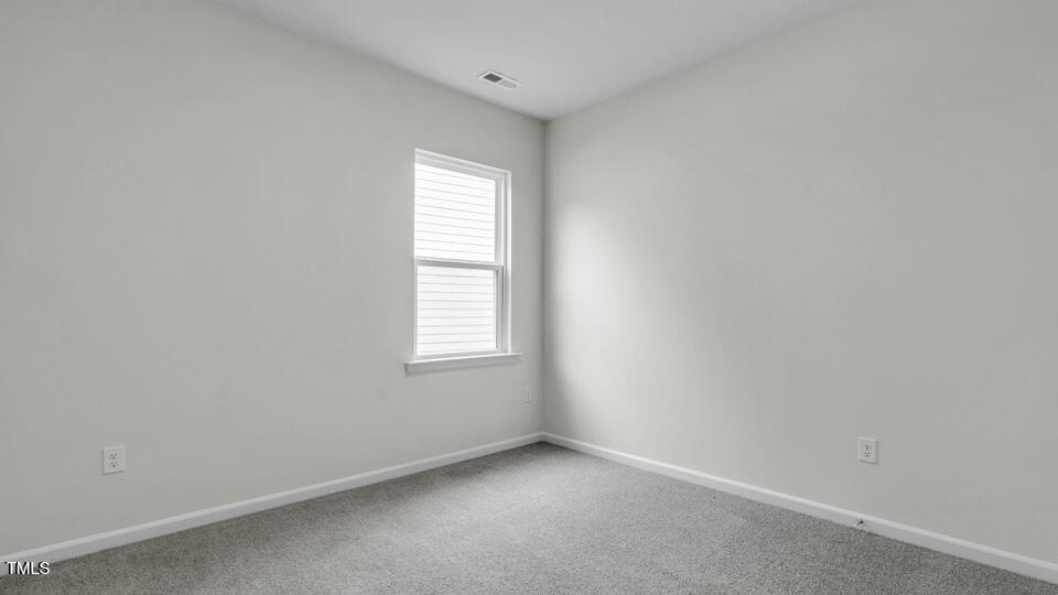 905 Comice Pear Way Willow Spring, NC 27592 - Photo 19 of 33 an empty room with a window