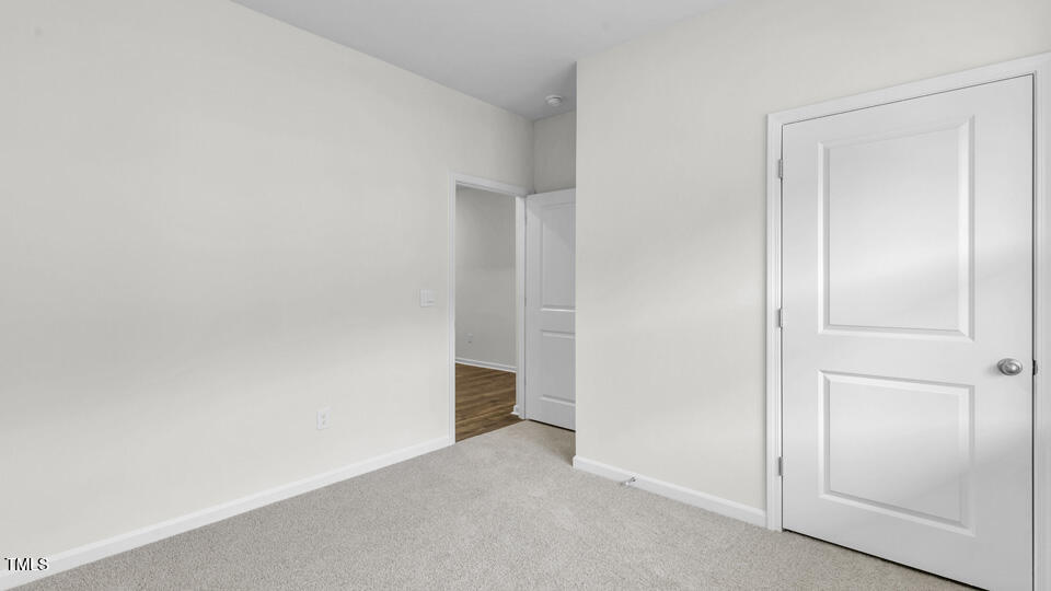 905 Comice Pear Way Willow Spring, NC 27592 - Photo 21 of 33 a view of an empty room